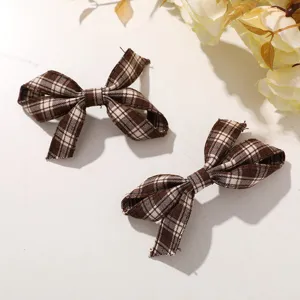 Brown plaid fabric bow hair clip set, cute retro side clip hair accessory for daily wear.