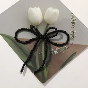 Black beaded bow DIY handmade accessories for shoes, earrings, and cute bag charms.