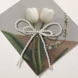 Imitation pearl bow DIY handmade shoe clip bag charm jewelry accessory, elegant decor item.