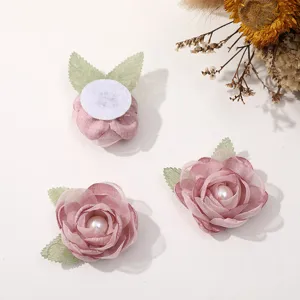 Handmade pink mesh flower DIY accessories with green leaves and pearl centers for hair clips