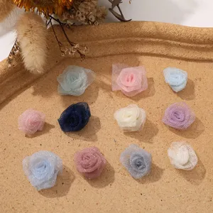 Closeup of miniature mesh rose flower heads, perfect for DIY crafts and apparel accessories.