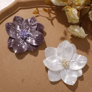 Shiny silk fabric flower detail showing exquisite stamen and petal texture for DIY crafts.