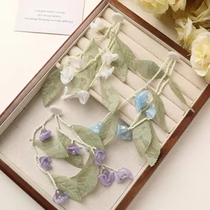 Fairy green leaf tulle lily of the valley flower diy earrings accessories detail view.
