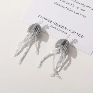 Handmade beaded jellyfish earrings pendant grey tassel design creative jewelry detail shot