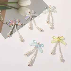 Gorgeous iridescent bow pearl pendant DIY handmade beaded hair clip and earring accessory.