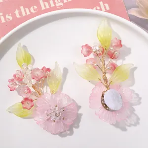 Detailed view of handmade crystal lily of the valley flower hair clip accessory