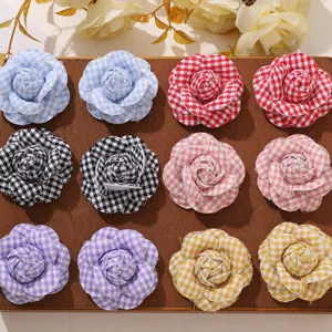 Detailed view of DIY Korean style plaid camellia fabric flowers, perfect for accessories.