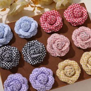 Colorful gingham fabric camellia flowers, perfect for DIY hair clips, brooches, and garment accessories.
