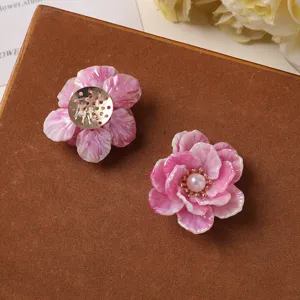 Pink gradient acrylic flower petals with pearl and metal base for DIY handmade jewelry crafts.