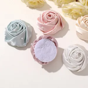 Fabric satin rose flower patches with pearls detail view for DIY crafts and accessories.