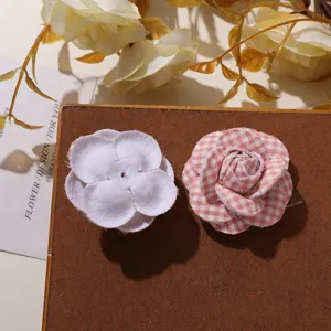Handmade fabric camellia flower patch ideal for stunning DIY hair accessories and decor.
