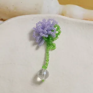 Handmade beaded flower pendant with clear crystal ball detail for DIY jewelry making.