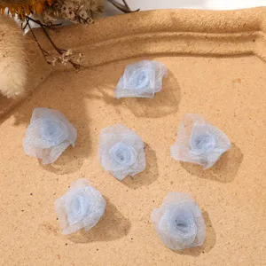 Detail view of mini mesh rose flower buds, light blue DIY handmade accessories for hair clips.