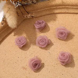 Detailed view of mini mesh rose flower buds, perfect for DIY crafts, hair accessories and clothing.