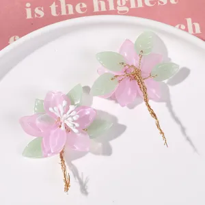 Handmade pink magnolia flower hair accessory DIY craft material, elegant retro design.