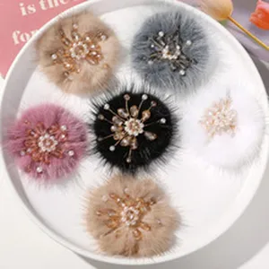 Detail view of fluffy plush floral hair accessory with pearl beaded stamens, diy craft.