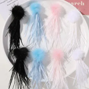 Detailed close-up view of fluffy feather tassels hair accessories in multiple vibrant colors.