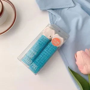 Detail view of portable hair roller pins set for creating natural volume and styling roots easily.