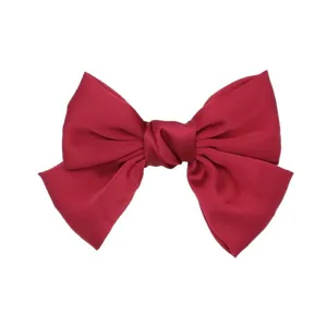 Large red satin bow hair clip, elegant hair accessory for women and daily fashion styling.