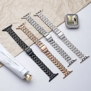 Stainless steel five-bead watch band with folding buckle, detailed close-up shot.