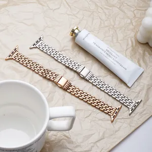 Stainless steel five-bead replacement watch strap compatible with Apple Watch, stylish design.