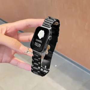 Stainless steel metal watch strap detail view, black three-bead design with folding clasp.