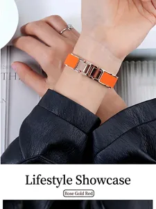 Nahaufnahme des eleganten orangefarbenen und roségoldenen Metall-Armband-Uhrenarmbands.