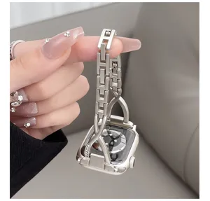 Detailed view of metal H-link cross diamond watch band compatible with Apple Watch.