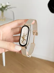 Replacement metal mesh strap for Xiaomi smart band, elegant golden magnetic closure design.