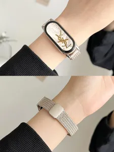 Replacement metal mesh strap with magnetic clasp for Xiaomi smart band, elegant women accessory.