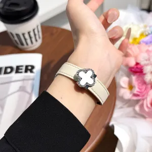 Exquisite leather replacement strap for Apple Watch featuring a stylish clover buckle.