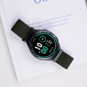 Smartwatch with green woven nylon strap detail view showcasing clear screen display.