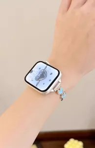 Stainless steel metal watch band compatible with smartwatches featuring blue heart charms.