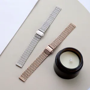 Stainless steel mesh watch band detail view, sparkling metallic texture, folding clasp.