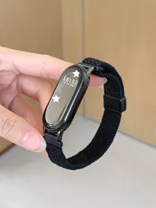 Detailed view of black woven nylon replacement watch strap compatible with smart fitness band.