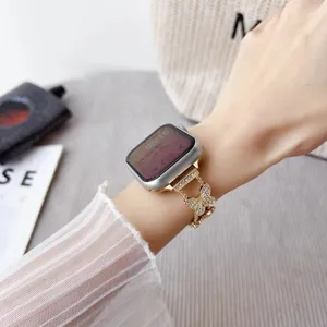 Detailed view of luxury rhinestone butterfly metal watch strap, sparkling crystal details.