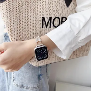 Metal butterfly rhinestone watch band compatible with Apple Watch series, elegant women accessory.