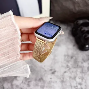Gold metallic mesh watch strap detail, fine Milanese loop design for smartwatch elegance.