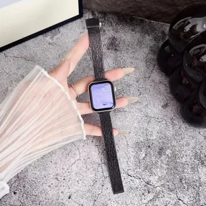 Detailed view of the sleek black metal mesh watch strap showcasing elegant texture and design.