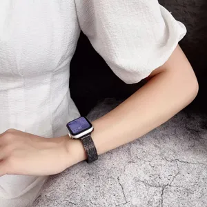 Metal watch strap compatible with smartwatches, featuring a fine woven texture and secure metal clasp.