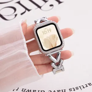 Detailed shot of sparkling rhinestone watch case and stylish V-shape metal strap for smart watch.