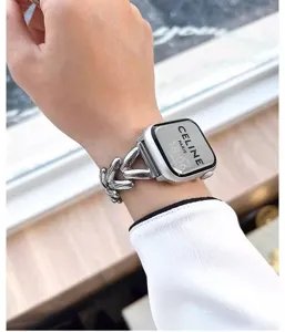 Metal heart chain strap compatible with Apple Watch, stylish women's wristband accessory.