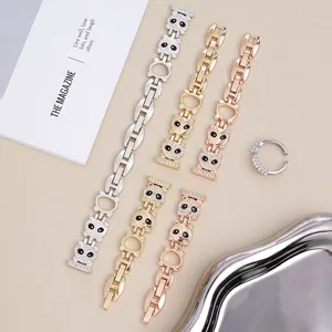 Detailed view of metal chain watch bands with sparkling rhinestones and cute panda charms.