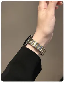 Stainless steel metal replacement strap compatible with Apple Watch, dual-tone link design.