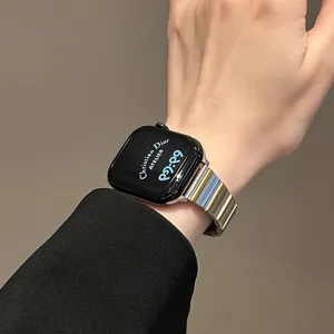 Stainless steel metal strap with butterfly buckle for Apple Watch, sleek design.