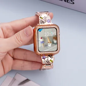 Close-up detail of rose gold rhinestone Apple Watch metal band with cute charms and crystal case.
