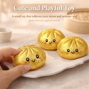 Χαριτωμένο χρυσό squishy παιχνίδι σε σχήμα dumpling για ανακούφιση από το στρες και παιχνίδι