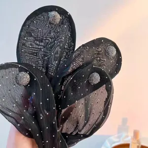 Black mesh hair bun maker detail, elegant rhinestone bead decoration for easy styling.