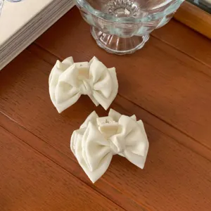 White satin bow hair claw clips for women, sweet small hair accessories for stylish daily use.