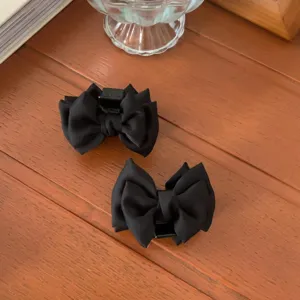 Black satin bow hair claw clip, small size hair accessory for women and girls styling.